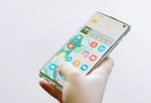 person using silver Android smartphone